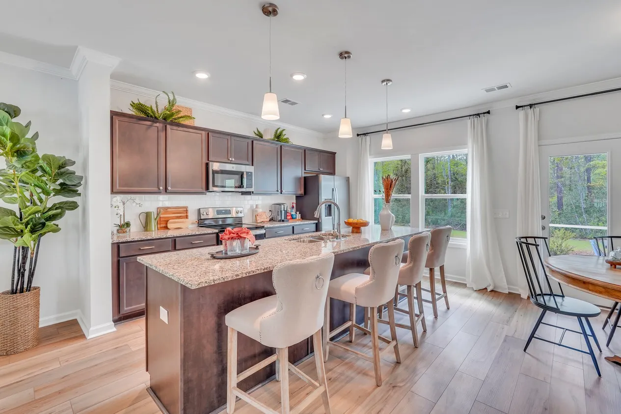 Mungo’s McDowell plan kitchen with island and cabinetry